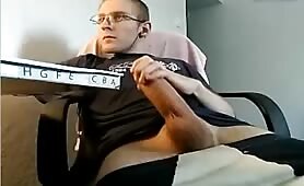 Nerdy dude stroking his fat long monster cock