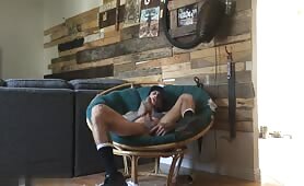Sexy black rubbing his cock on a sofa