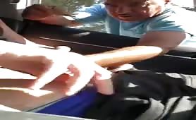 young dude receives a handjob by an older guy in his car