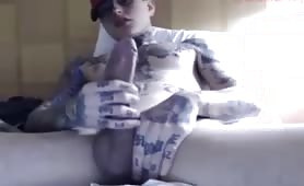 Cute tattooed young guy stroking his tasty cock solo