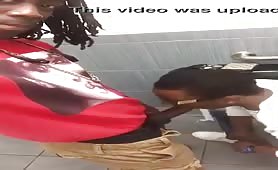Jamaican dude getting his dick sucked by his coworker in public toilet