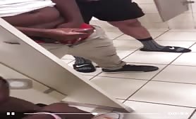 Group of horny guys stroking their cock in public toilet