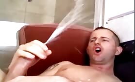 Horny dude having a huge orgasm and shooting a huge load