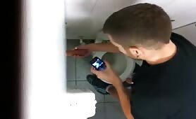 Sucking a stranger guy cock thru a hole in a public bathroom