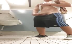 Young guy does a solo in the university bathroom