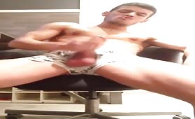 Cute stud doing a solo in front of the webcam