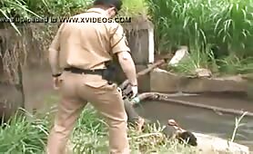 Brazilian cop catches a tramp jerking off outdoors