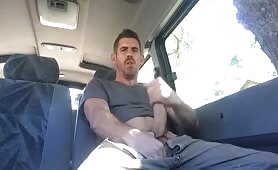 Sexy stud rubbing his cock in an uber truck