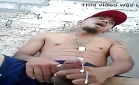 Horny latin thug rubbing his cock outdoor