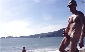 muscled daddy jerking off in a public beach