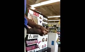 Black guy rubbing his cock in a supermarket in front of everybody