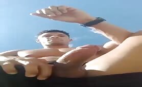 Showing off my huge cock on the beach