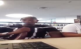 Horny college black dude rubbing his cock in a public library
