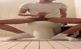 Horny straight dude rubbing his cock in the toilet
