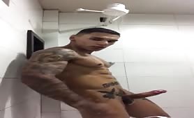 Tattooed latina taking shower and masturbating