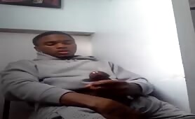 Young black stroking his cock during a work break