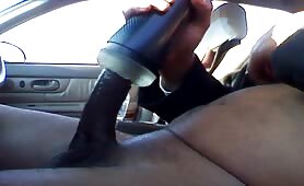 Chubby black using a flesh light to masturbate in his car