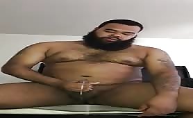 Huge bearded bear doing his early morning stroke