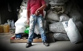 Horny mechanic latino offering cock in a warehouse